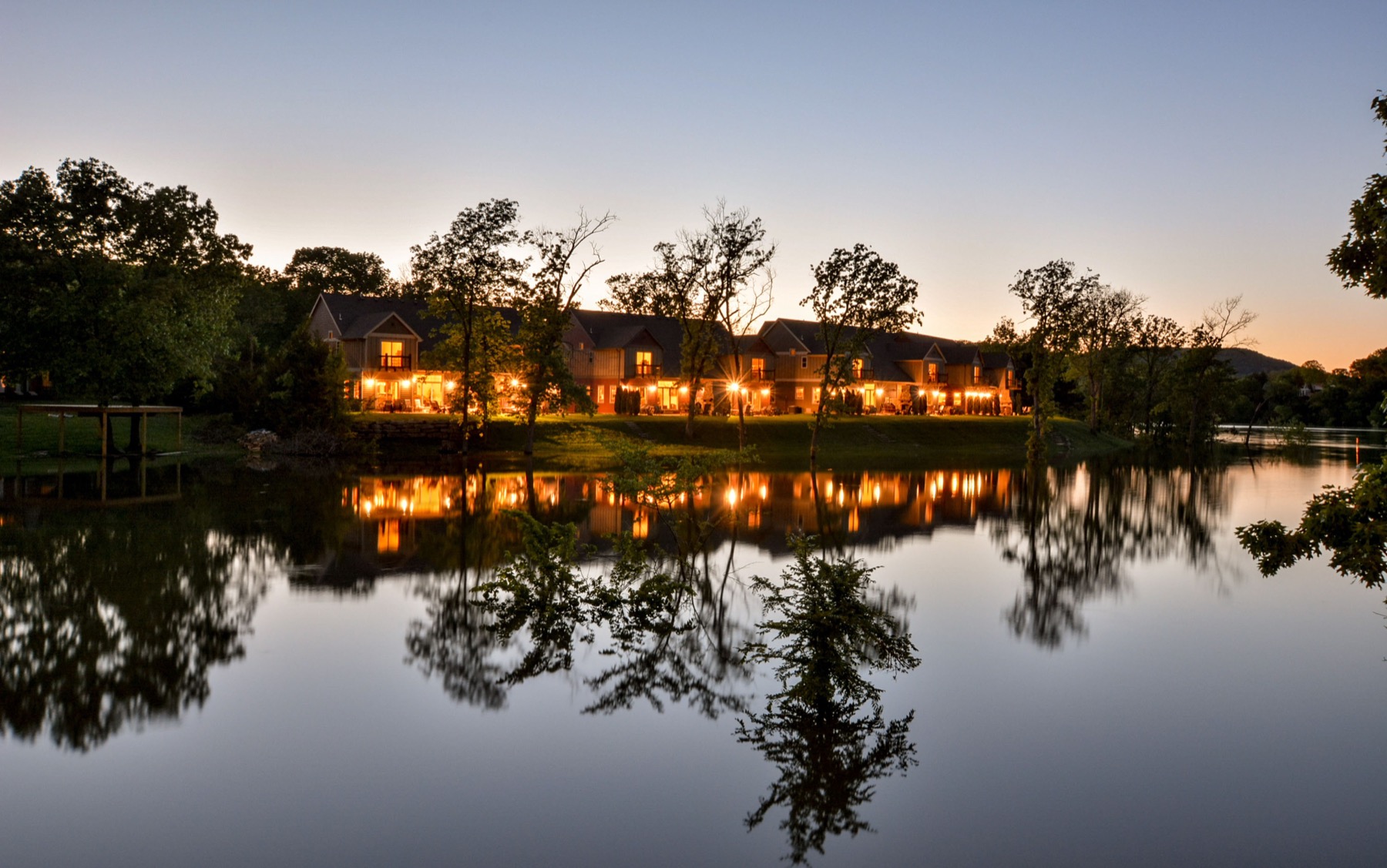 Chalets on Table Rock Lake villas reflected in the lake at twilight